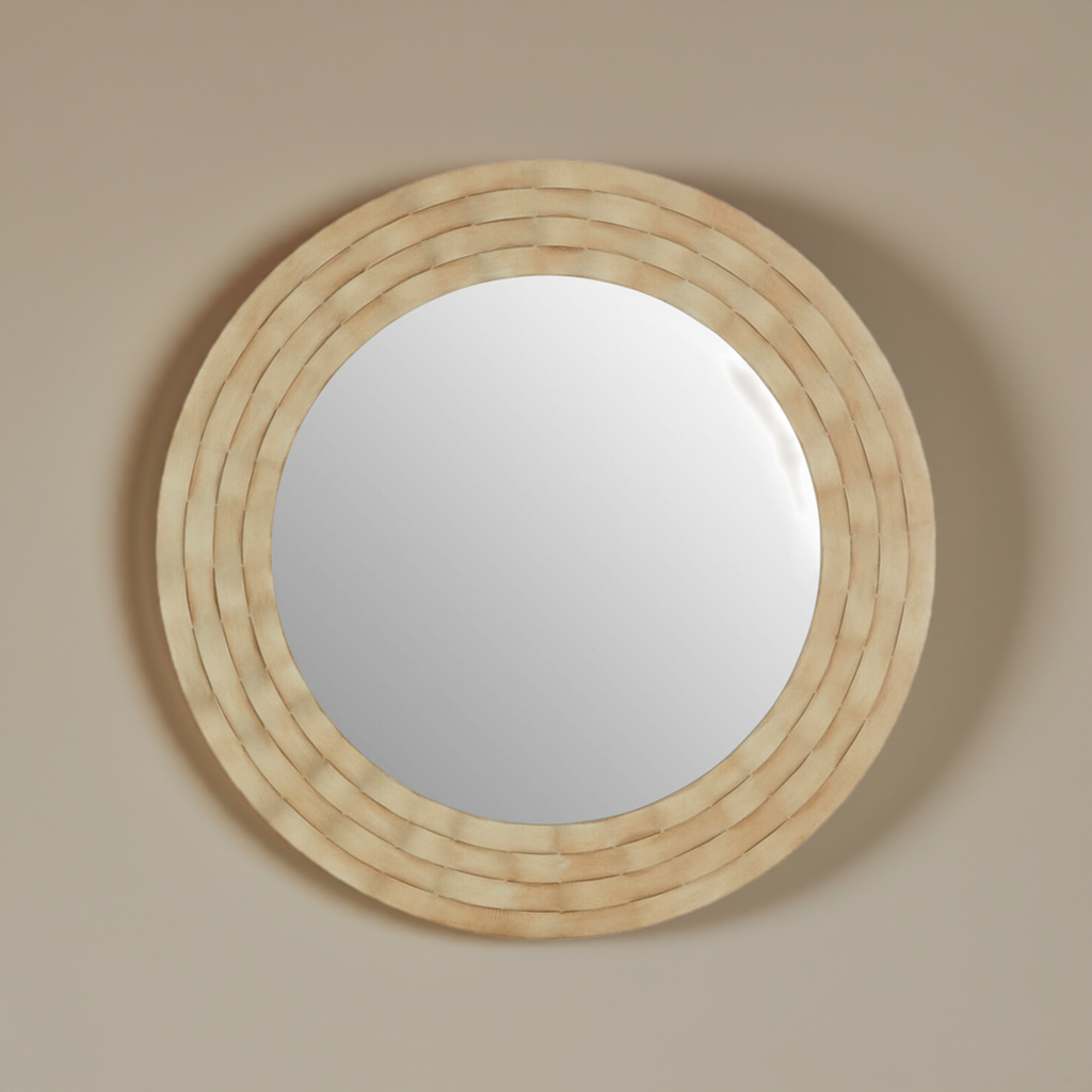A round wall mirror with a wooden banded frame, on a neutral coloured wall